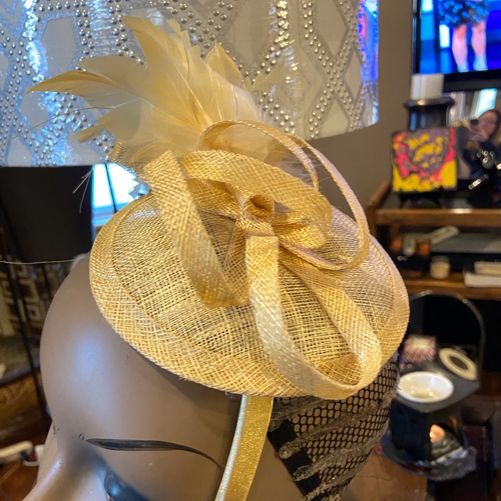 New with box.  Tan fascinator for all occasion